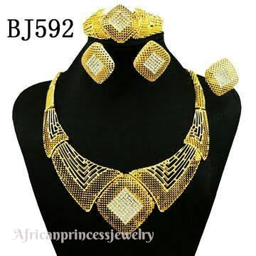 FOUR PIECE 18K GOLD PLATED NECKLACE SET