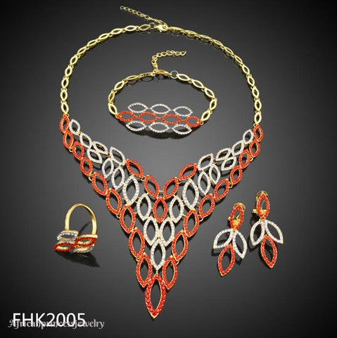 FOUR PIECE 18K GOLD PLATED NECKLACE SET