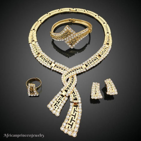 FOUR PIECE AFRICAN GOLD PLATED NECKLACE SET