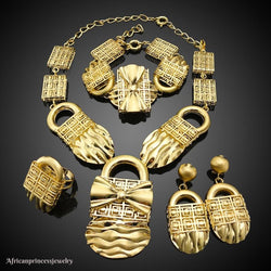 FOUR PIECE AFRICAN GOLD PLATED NECKLACE SET.