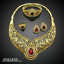 FOUR PIECE AFRICAN GOLD PLATED NECKLACE SET